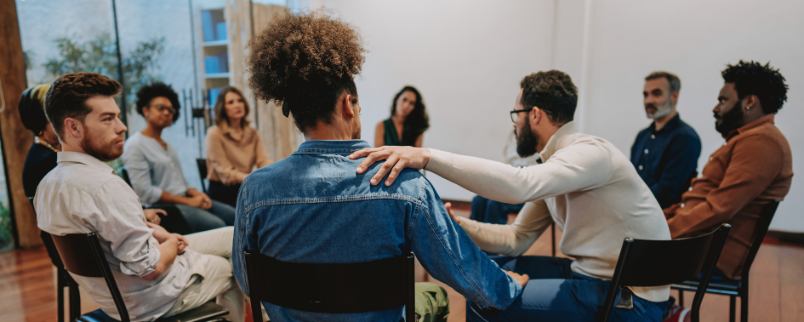 Executive peer support resources pic shows group therapy session