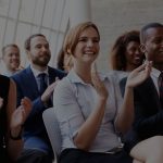 Professional aa meetings pic shows group clapping for speaker